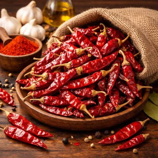 Dried red chillies spilling from a bowl